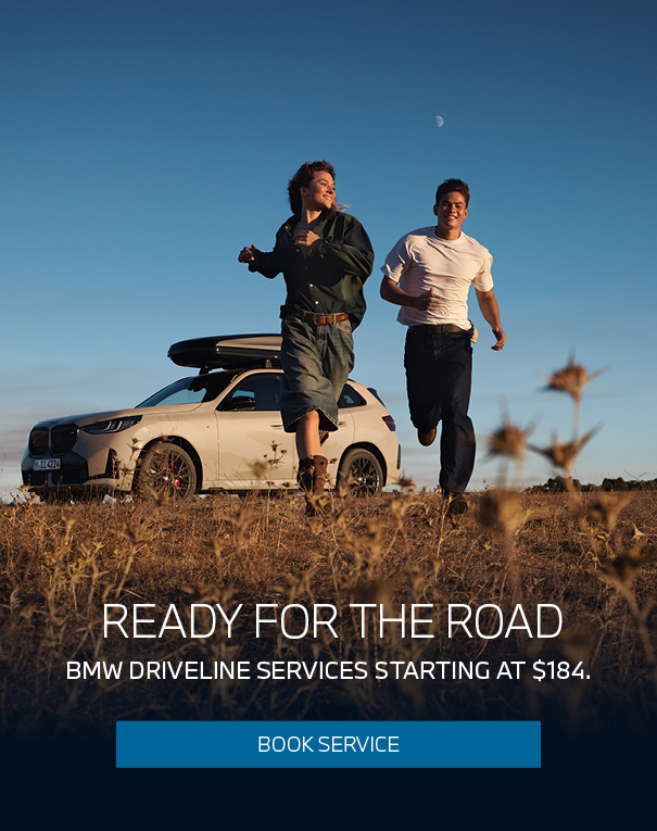 Promo image of two people running in a field with a BMW in the background